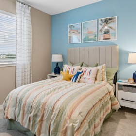 bedroom with a bed end table and lamp